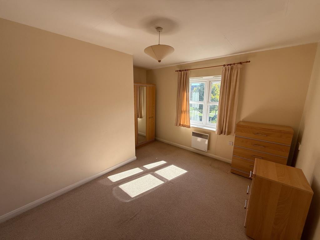 Lot: 136 - VACANT TWO-BEDROOM COACH HOUSE APARTMENT WITH GARAGE - Bedroom two with window to the front